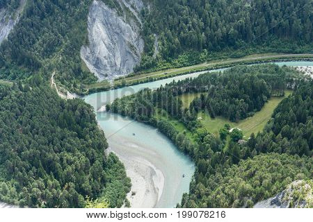 top view of boat river rafting in a valley in flims switzerland