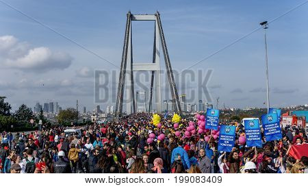 Istanbul Turkey - November 2015: People crossing the bridge during Vodafone Istanbul Marathon. It is a truly intercontinental and unique event.