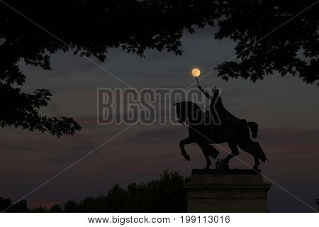 July 7 2017 - St. Louis Missouri - The sunset over the Apotheosis of St. Louis statue of King Louis IX of France namesake of St. Louis Missouri in Forest Park St. Louis Missouri.