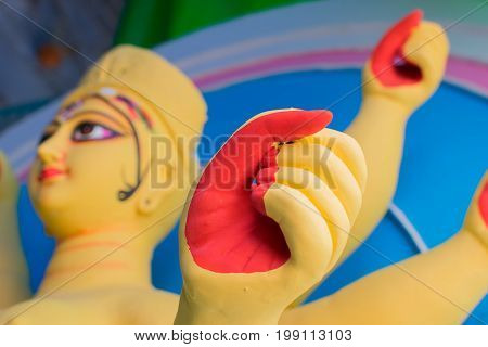 KOLKATA WEST BENGAL INDIA - 25 SEPTEMBER 2016: Clay idol of Goddess Durga's face under preparation for "Durga Puja' festival in Kumartuli Kolkata. Biggest festival of Hinduism.