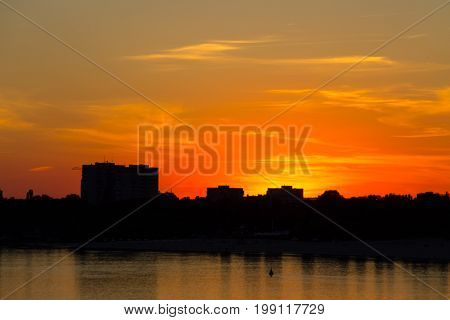 Orange Sunset Over A River Dnieper In Kremenchug City, Ukraine