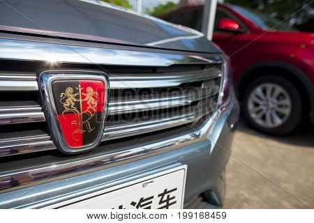 Dongguan, Guangdong, China - August 7, 2017: Closeup view of Roewe Chinese automobile on display at Dongguan car exhibition awaiting prospective buyers