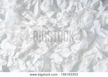 Many used screwed paper tissue isolated on white background