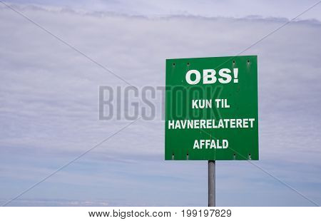 Harbor sign: NOTE For port-related waste only. Oesterby harbor on Laesoe Denmark