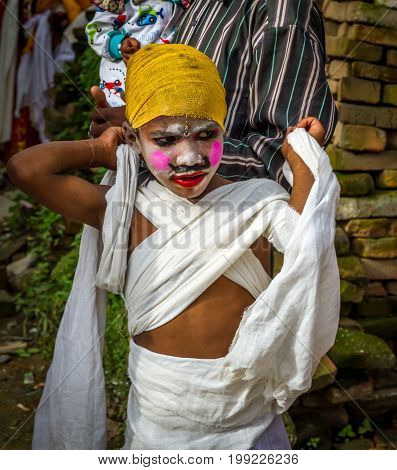 KathmanduNepal - August 82017:Gai Jatra is a carnival of dancing singing mirth and laughter. The festival of cow is celebrated mainly in the Kathmandu Valley to commemorate the death of loved ones. As part of the festival family members of the deceased of