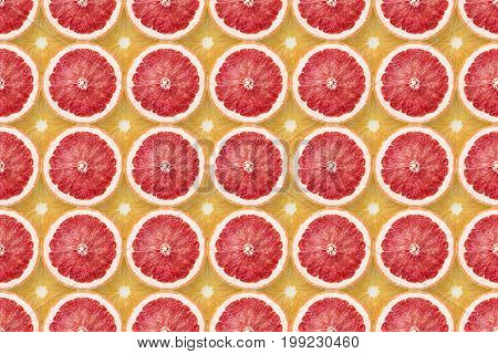 many grapefruit slices over orange seamless pattern