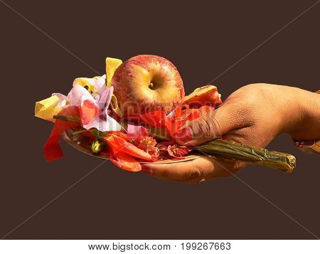 Woman hand with offer on Shiva Monday, Nepal. black background