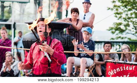 Quebec City - July 05 2017: Monsieur Rene entertains tourists at Terrasse Dufferin. Different artists do presentations at the same place during the summer in Quebec City.