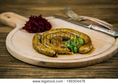 Slovak traditional food - white pudding on a wooden board.