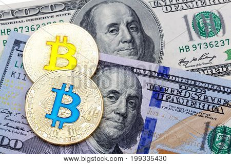 Golden bitcoins on US dollars. Electronic money exchange concept. High resolution photo.
