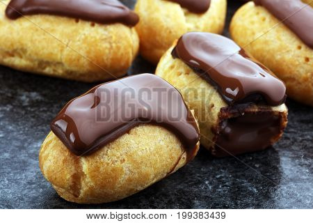 Traditional French Dessert. Eclair With Chocolate Icing. Pastery Concept