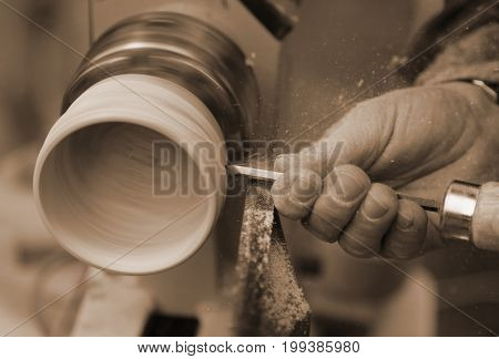 Skilled Craftsman With The Chisel During The Work Of The Wood Pi