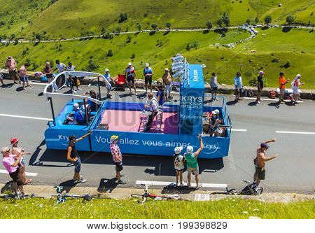 Col de PeyresourdeFrance- July 23 2014: Krys vehicle during the passing of the Publicity Caravan on the road to Col de Peyresourde in Pyrenees Mountains in the stage 17 of Le Tour de France on 23 July 2014.Krys is a major chain of optical stores in France