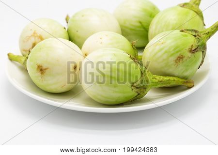 Green eggs plant close up on white background