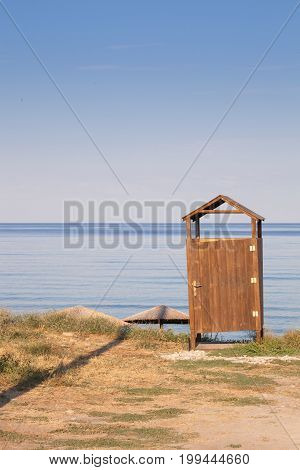 Wooden Beach hut at the sunny shore