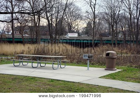 SHOREWOOD, ILLINOIS / UNITED STATES - DECEMBER 6, 2015: Picnickers may sit at a picnic table in the Hammel Woods Forest Preserve in Shorewood, Illinois.
