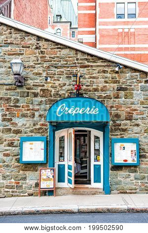 Quebec City Canada - May 29 2017: Creperie restaurant building in upper old town with menu and blue decoration
