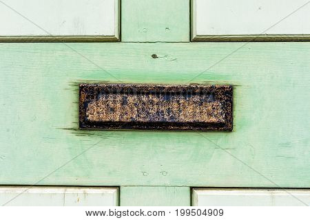 Vintage Metal Mail Slot In Door With Painted Green Wood