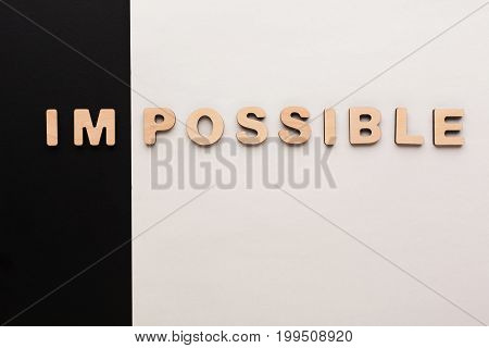 No impossible, only possible concept. Meaning change on black and white background, challenge, motivation concept