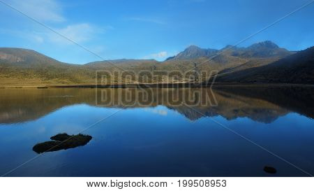 Ruminahui volcano reflected in the Limpiopungo lagoon inside the Cotopaxi National Park - Ecuador