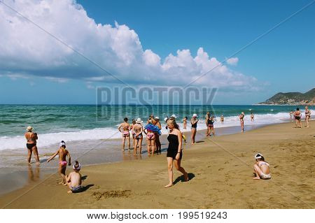 July, 2017 - Vacationers bathe in the sea and sunbathe in the sun on Cleopatra Beach (Alanya, Turkey).