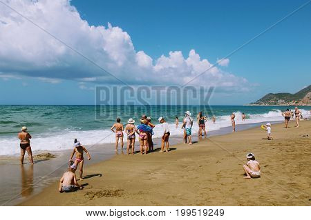 July, 2017 - Vacationers bathe in the sea and sunbathe in the sun on Cleopatra Beach (Alanya, Turkey).