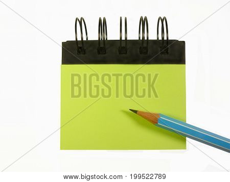 notebook on pencil isolated on white background