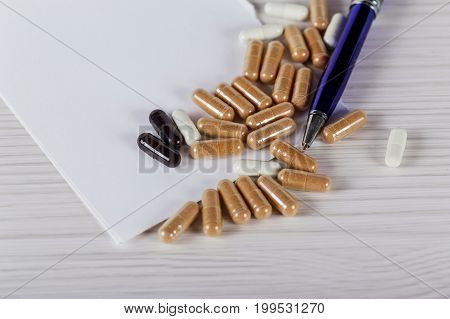 Close Up Vitamin Pill On Wood Table, Healthy Concept