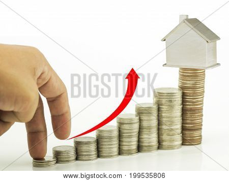 Mortgage concept hand walked step by step and stacked on money on coins with wood house concept as buying saving selling financeaccount and invetment for home and condominuim