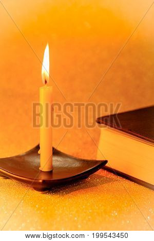 Still Life Golden Candle Light And Bible Book On Golden Blurred Bokeh Background. ,abstract Backgrou