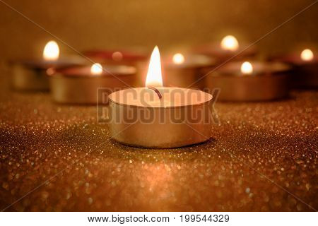 Prayer And Hope Concept. Retro Candle Light With Lighting Effect And Glitter Abstract Background Wit
