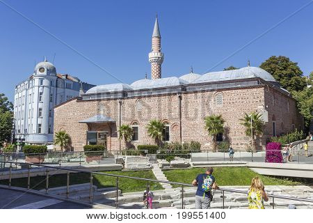 PLOVDIV BULGARIA - JULY 30: Tourists pass along Old Mosque in Plovdiv on July 30 2017 Bulgaria.