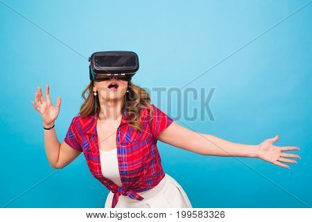 Happy young woman using a virtual reality headset
