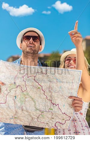 Couple tourist traveling and using map. Couple tourist exploring a city