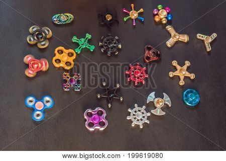 A Lot Of Different Spinners On A Black Background