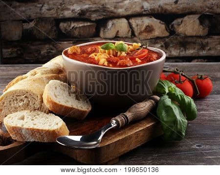 Tomato soup with meatballs in a bowl. Italian minestrone soup