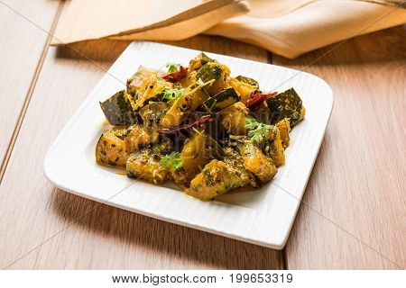 Popular indian main course vegetable Pumpkin dry curry or kaddooor kaddu ki sabzi in hindi, lal bhopla chi bhaji in marathi, selective focus