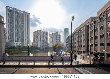 Shanghai, China - Nov 6, 2016: Along Xizang Middle Road, crossing the Wusong or Suzhou River. Image captured from a public bus.