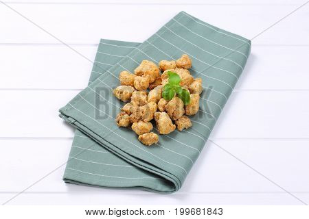 pile of soy meat cubes on grey place mat