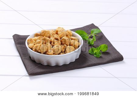 bowl of soy meat cubes on grey place mat