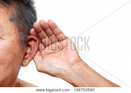 Old man paying attention to listening sound Age-related hearing loss problem in elderly.