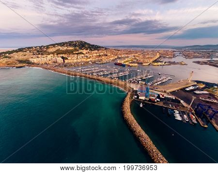 aerial view of the city of sete, france, with mont saint-clair and port. photo taken at sunrise.