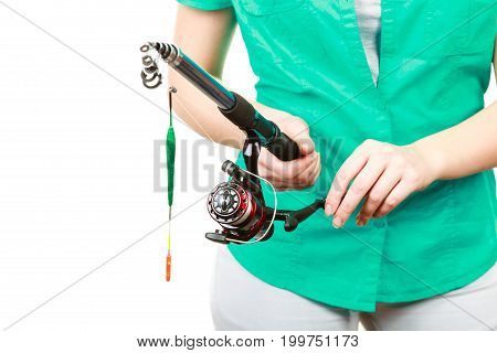 Spinning sport equipment concept. Person holding fishing rod with float and waggler with line.