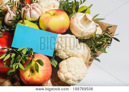 autumn bouquet of fresh fruits vegetables and mushrooms as concept of accumulate vitamins for the winter