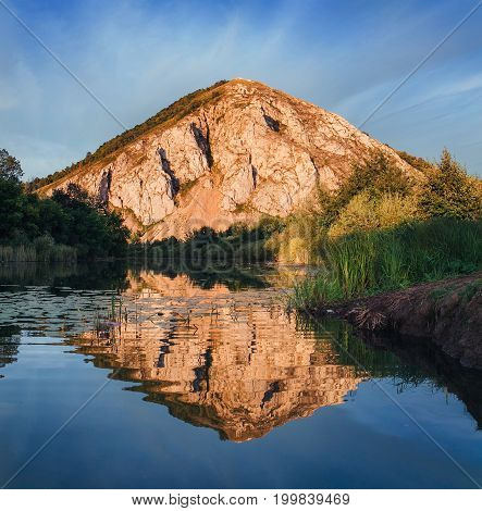 Lake With Reflection Of The Hill At Sunset. Shihan, Bashkortostan
