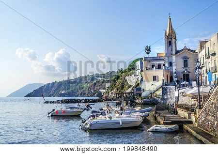 Sports boats are appreciated its berth and the parish of San Giussepe of the year fifteen hundred and forty-five on the island of lipari italy