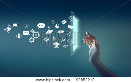 the hand touching the sceen with a lot of icon throw out from sceen technology about internet of thing concept.