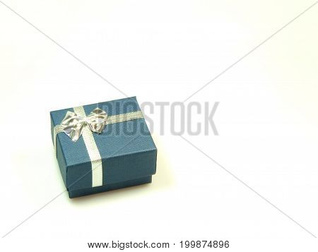Little present wrapped in blue and silver