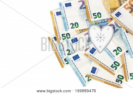 White and grey heart on euro banknotes bills. love and money