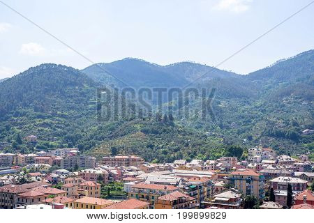Beautiful daylight view to green mountains and buildings of Levanto, Italy. Cinque Terre beauties